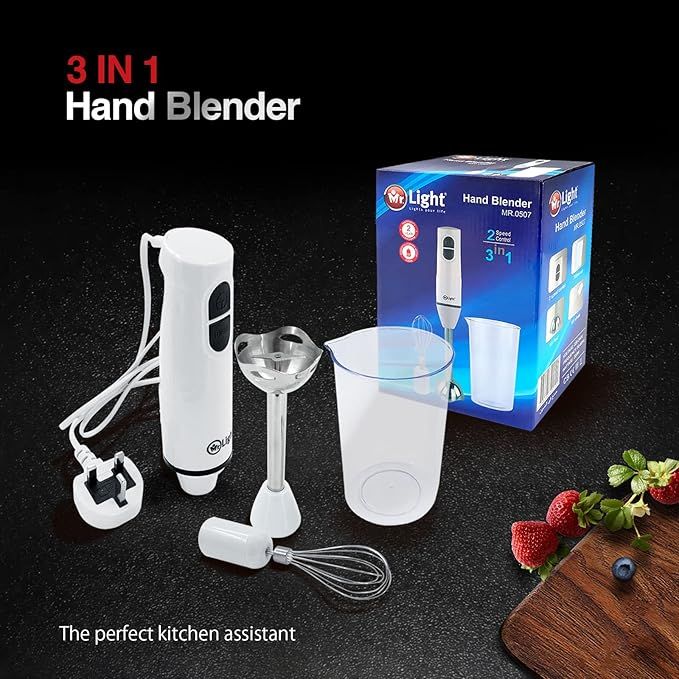 3-in-1 hand blender with accessories and packaging on a dark surface
