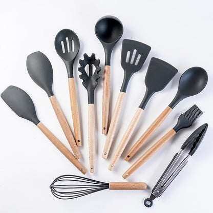 Set of kitchen utensils with black silicone heads and wooden handles on a white background