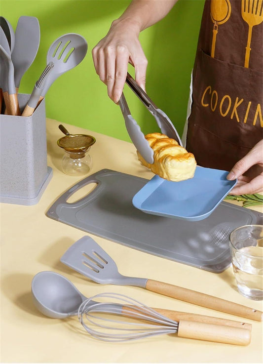 Person preparing food with kitchen utensils on a yellow countertop