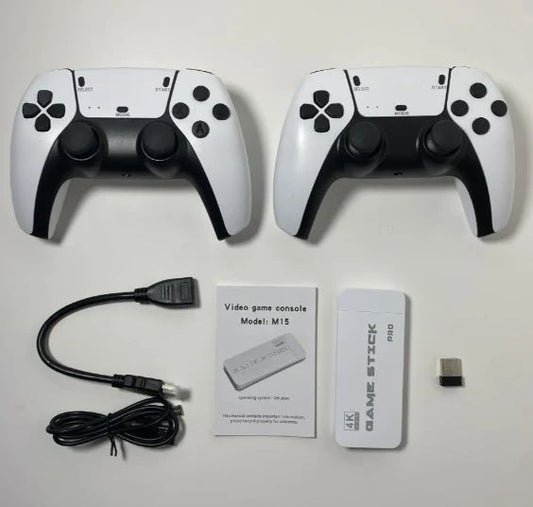 Two gaming controllers, a cable, and a power adapter on a white surface.